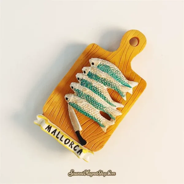 Mallorca sardines fridge magnet left-angle view showing 3D fish relief depth and cutting board thickness