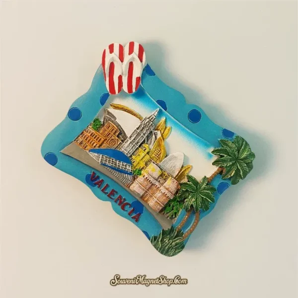 Valencia souvenir fridge magnet angled view showing 3D sculpted landmark relief depth and turquoise frame