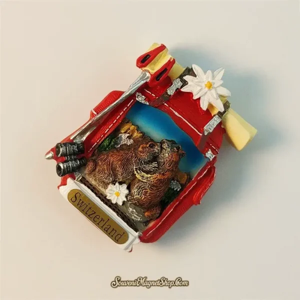 Close-up of a Switzerland Alps marmot travel gift magnet, highlighting the vibrant colors and detailed hand-painting of the alpine scene.