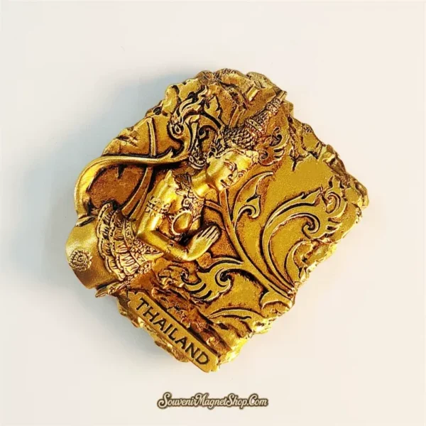 Thailand golden Theppanom angel fridge magnet top angle showing ornate scroll background and headdress