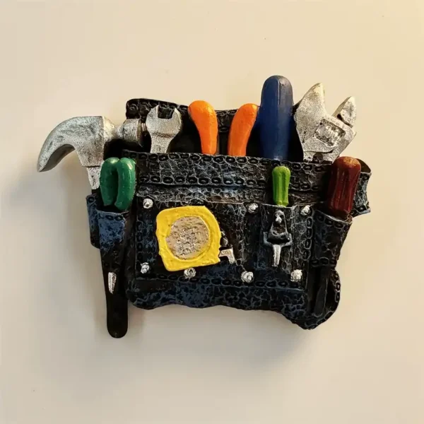 Fun 3D tool belt fridge magnet front view with colorful mini tools and silver hammer