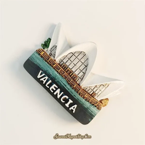 Valencia Spain fridge magnet left angle showing 3D depth of white arch fins glass lattice dome and teal water base