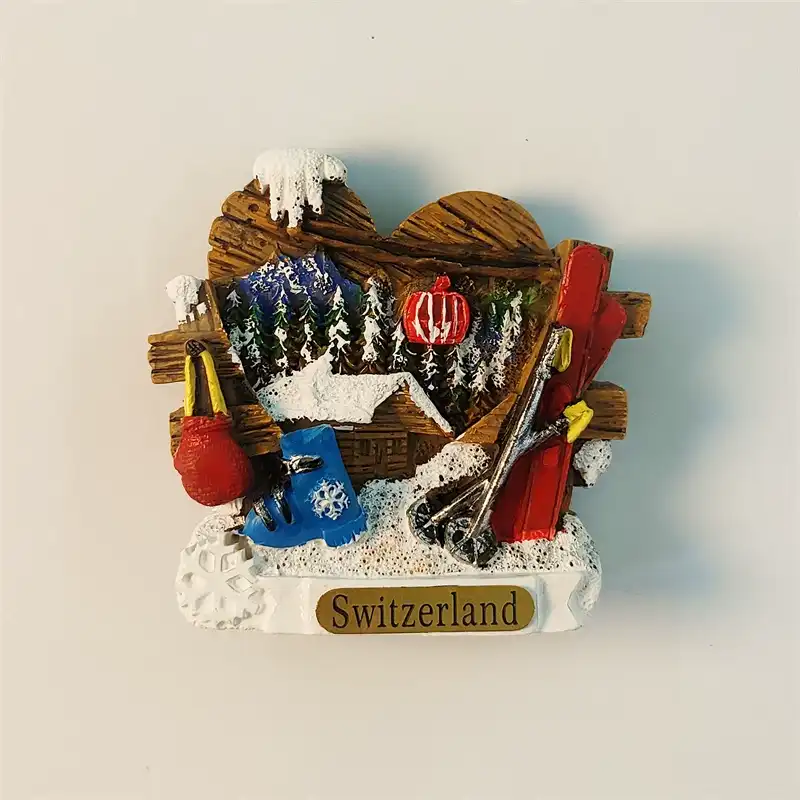 3D Switzerland Zermatt ski resort fridge magnet featuring miniature skis, boots, and a snowy cabin.