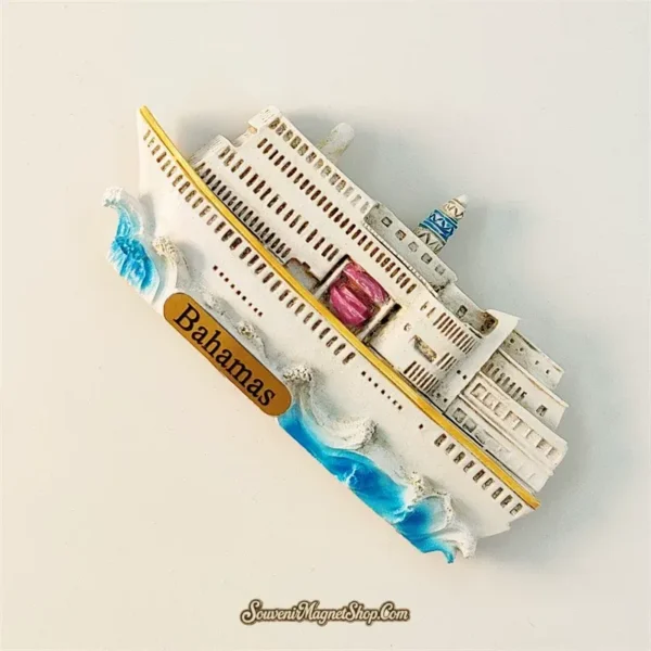 Bahamas cruise ship souvenir magnet left angle showing 3D relief depth of gold waterline stripe and pink funnel details