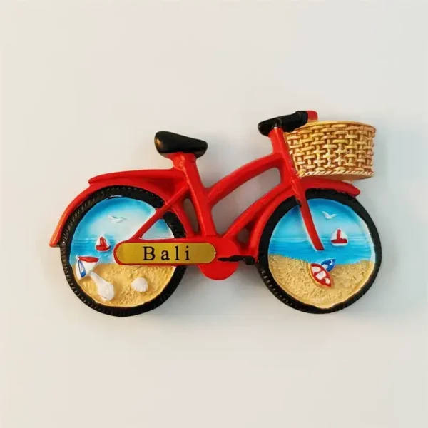 Red Bali beach bicycle fridge magnet front view with wicker basket and hand-painted coastal scene on wheels