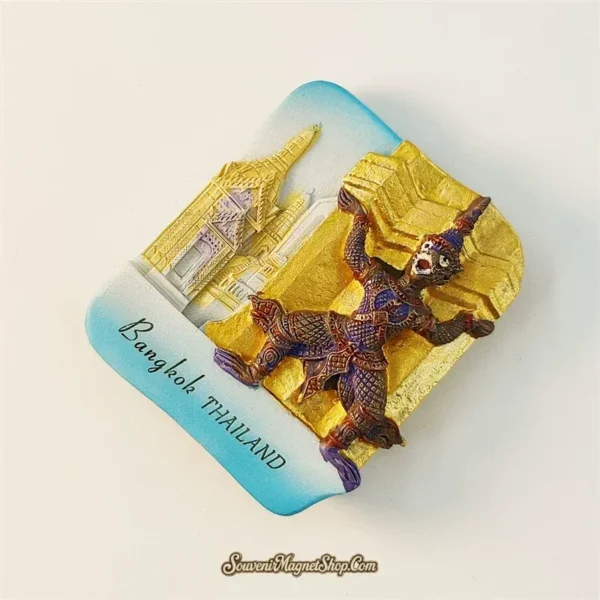 Bangkok Yaksha guardian souvenir magnet left angle showing 3D relief depth of armored figure and golden chedi