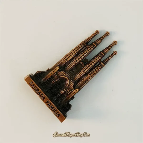 Top-angle view of the Sagrada Familia souvenir figurine showing detailed spire tips and engraved base plate