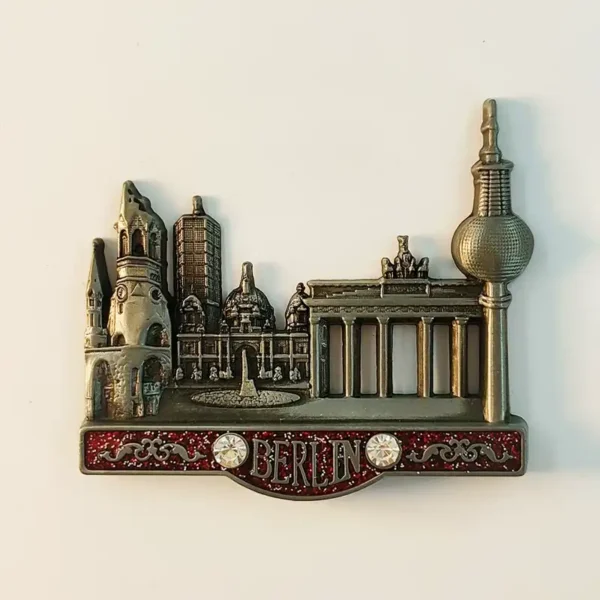 Front view of antique bronze Berlin metal fridge magnet with Brandenburg Gate TV Tower cathedral and red glitter base