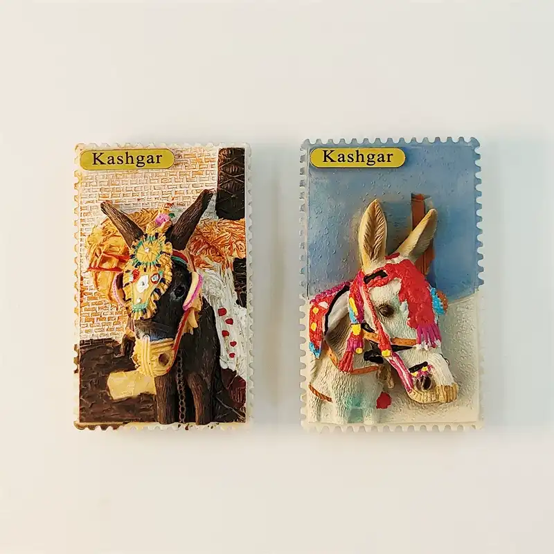 china-kashgar-decorated-donkey-fridge-magnet-set-front-view Front view of China Kashgar souvenir fridge magnet set with brown and white decorated donkeys in postage stamp style with Kashgar gold labels