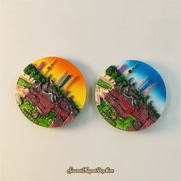 Shanghai Huxinting Teahouse souvenir fridge magnet angled view of both sunset orange and blue sky variants showing 3D depth of round resin disc with traditional teahouse and modern skyline