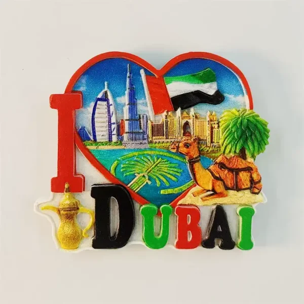 Front view of I love Dubai heart-shaped fridge magnet featuring 3D Burj Khalifa, Burj Al Arab, Atlantis The Palm, UAE flag, camel, palm tree and gold dallah coffee pot