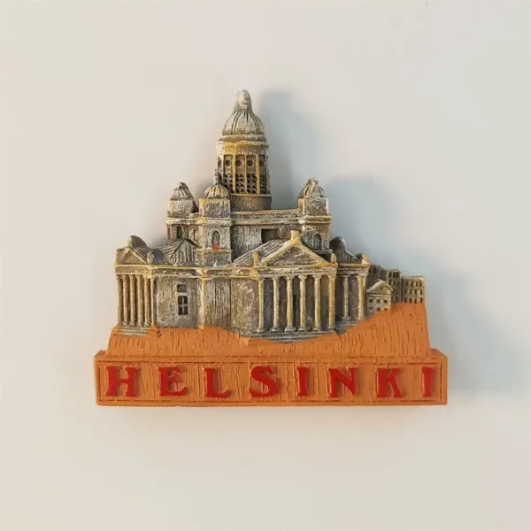 Hand-painted Helsinki Cathedral fridge magnet front view with red HELSINKI lettering on orange base