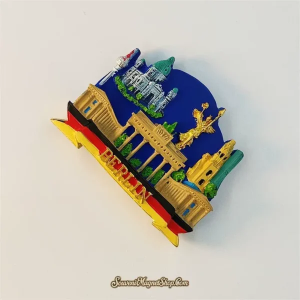 Angled view of Germany Berlin souvenir magnet showing 3D depth with Brandenburg Gate and golden Victory Column