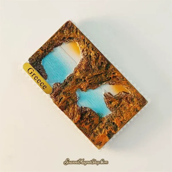 Angled view of Greece Kleftiko Beach souvenir magnet showing textured rock arches and Greece label