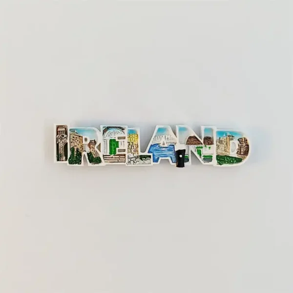 Front view of IRELAND letter fridge magnet with hand-painted landmarks including round tower, bridges, and cliffs