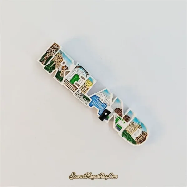 Angled view of 3D Ireland letter souvenir magnet showing raised hand-painted landmark details