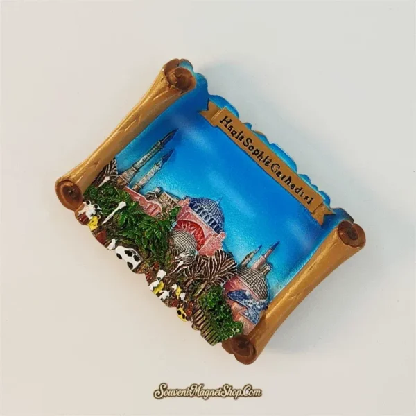 Angled view of hand-painted Hagia Sophia scroll magnet showing 3D relief domes and minarets