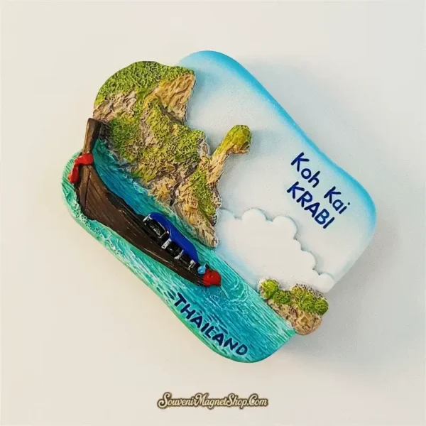 Angled view of Koh Kai Krabi fridge magnet showing 3D limestone cliffs and longtail boat detail