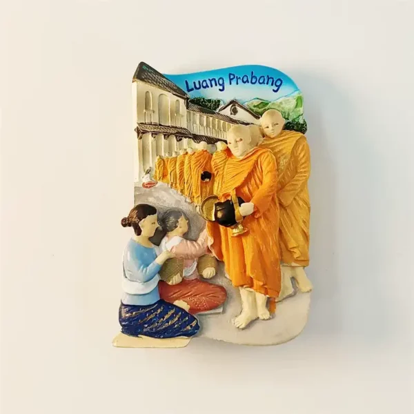 Laos Luang Prabang alms giving ceremony 3D fridge magnet front view with saffron-robed Buddhist monks receiving sticky rice from kneeling local women