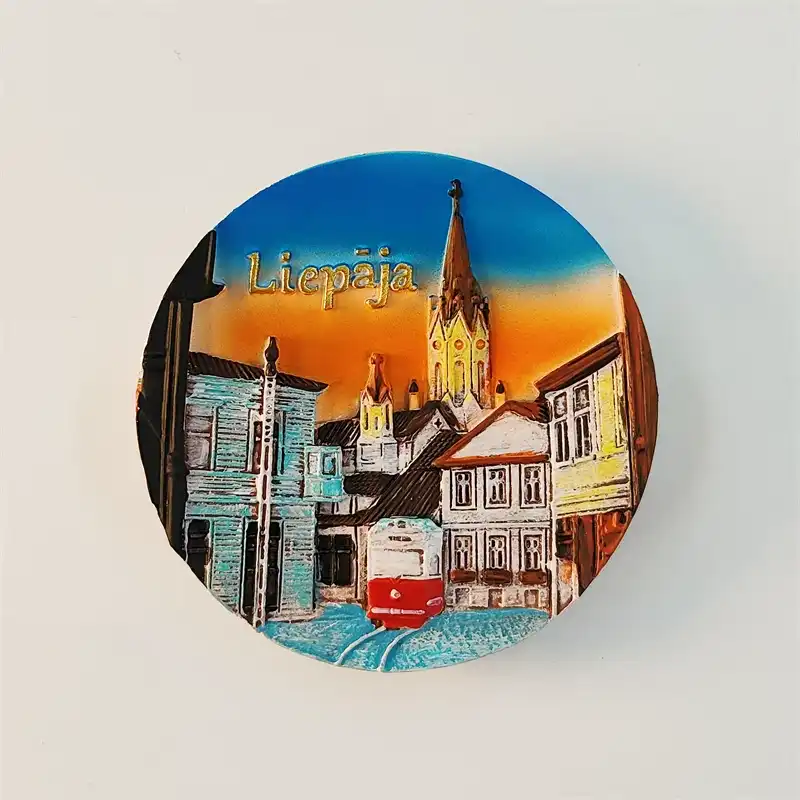 Latvia Liepāja 3D round fridge magnet front view with red tram Gothic cathedral spire and sunset cityscape