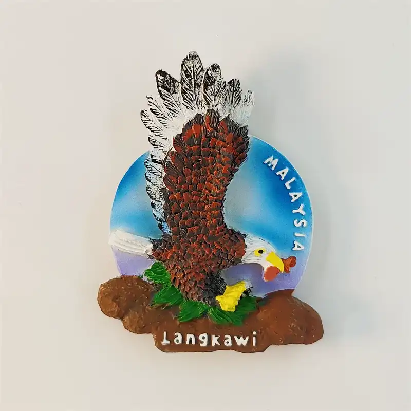 Malaysia Langkawi eagle fridge magnet front view with hand-painted 3D relief, spread wings, white head, and Langkawi rock base engraving