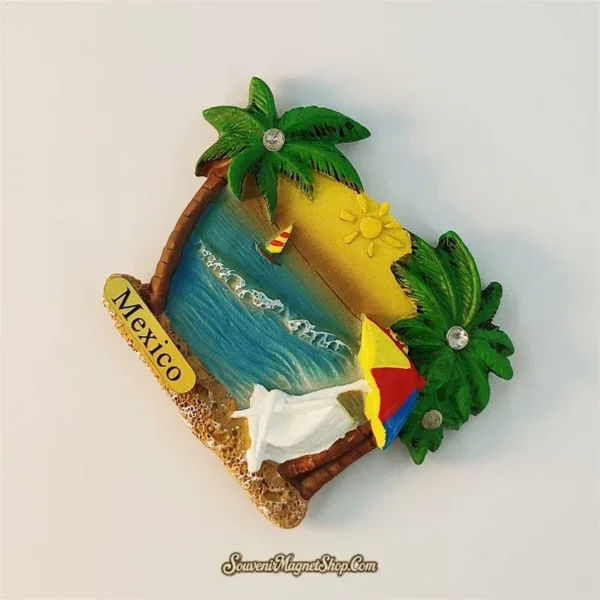 Angled view of Mexico Cancun beach souvenir magnet showing 3D depth with palm trees and ocean scene