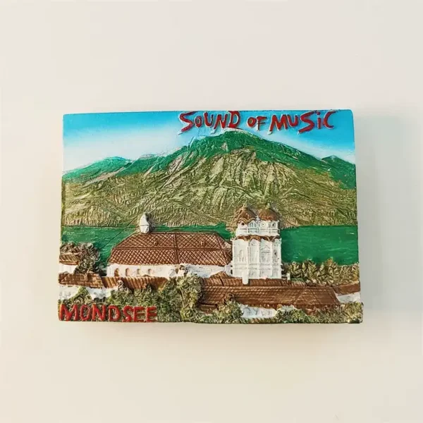 Front view of Mondsee Sound of Music fridge magnet with basilica, alpine mountain, and lake
