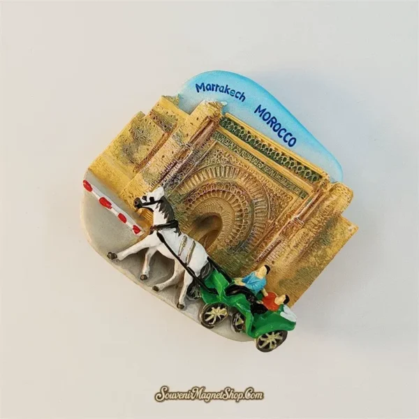Marrakech Morocco souvenir magnet angle view showing 3D caleche carriage and gate stonework relief
