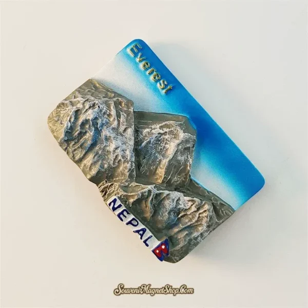 Nepal Everest souvenir magnet angled left view showing 3D relief depth and blue sky gradient
