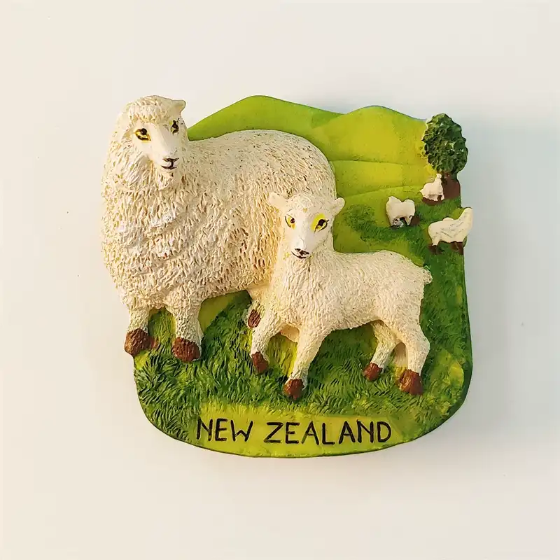 Front view of 3D New Zealand sheep fridge magnet with woolly ewe and lamb on green pasture hills