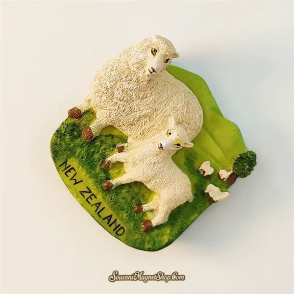 Left angle view of New Zealand sheep souvenir magnet showing ewe and lamb on pastoral hillside