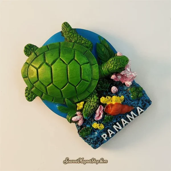 Panama sea turtle souvenir fridge magnet angled right view revealing 3D depth of sculpted green turtle shell coral reef base and vivid ocean colors