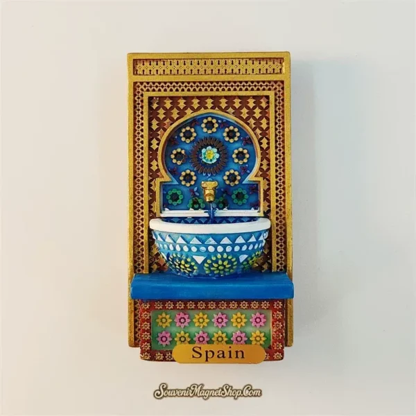 Spain Alhambra wall fountain fridge magnet gold amber frame with blue mosaic arch and blue white patterned washbasin