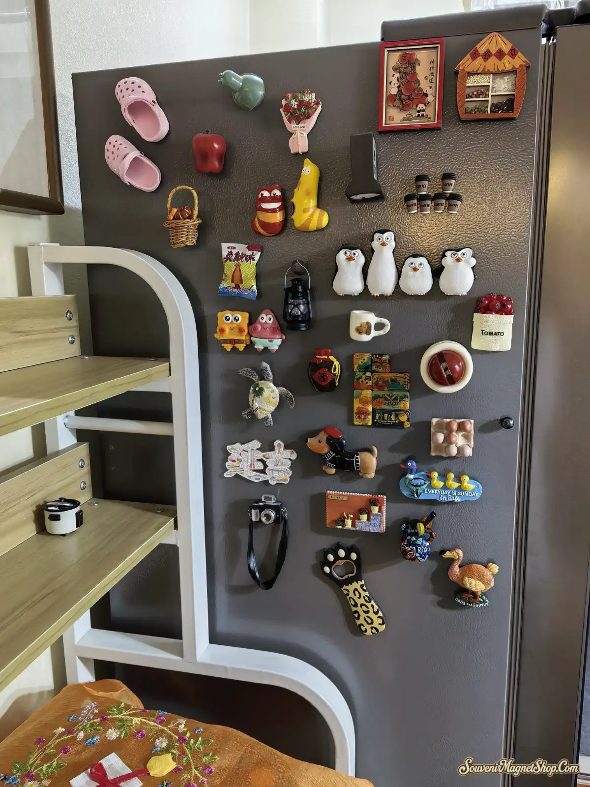Customer review photo of Budapest dachshund magnet displayed on tray among other fridge magnets