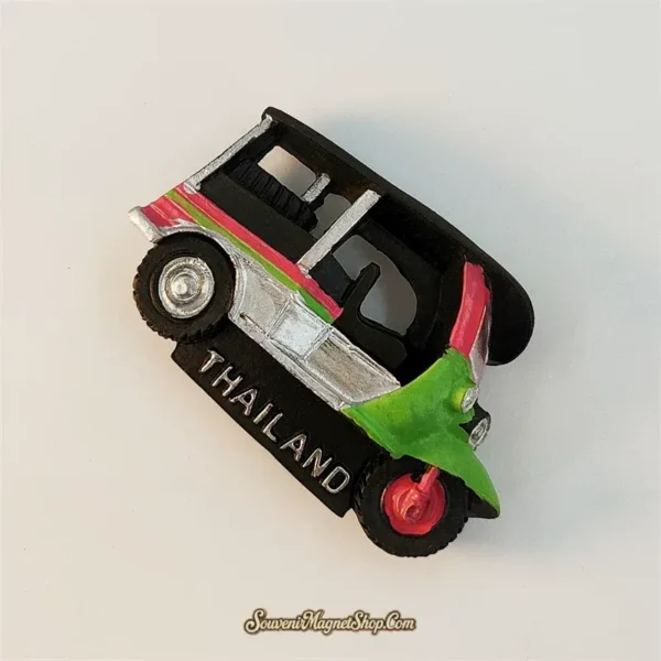 Angled top-left view of Thailand tuk-tuk vehicle souvenir magnet showing 3D canopy and stripe details