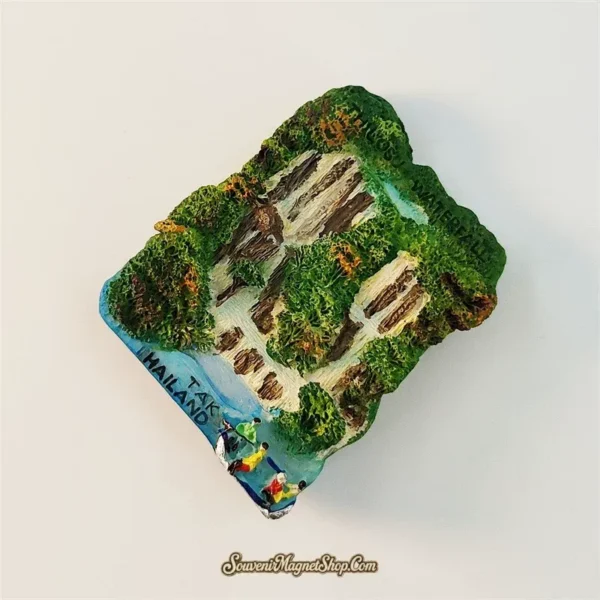 Thi Lo Su Waterfall souvenir magnet left angle showing 3D relief of tropical jungle cliffs