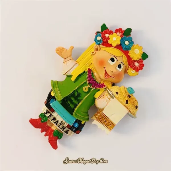 Ukraine souvenir magnet angled view showing folk girl in embroidered vest, flower crown and red boots with traditional paska