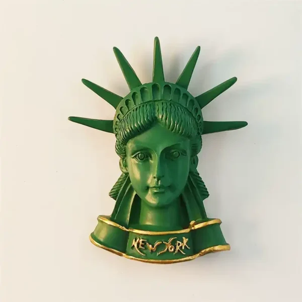 USA New York Statue of Liberty head bust 3D fridge magnet front view in green patina with seven-pointed crown and gold New York banner