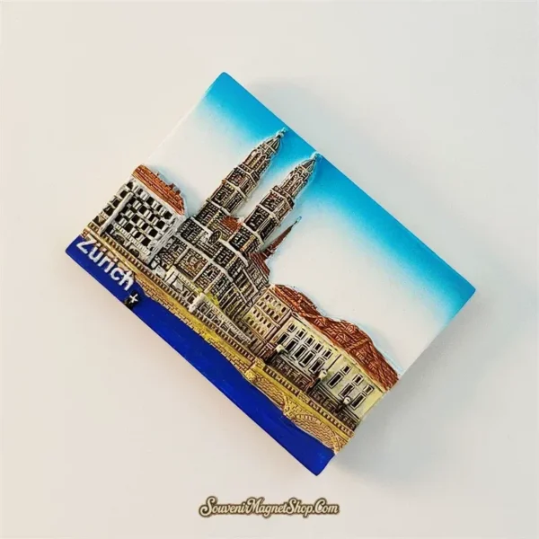 Zurich souvenir magnet left angle showing 3D relief of Grossmünster and Swiss buildings