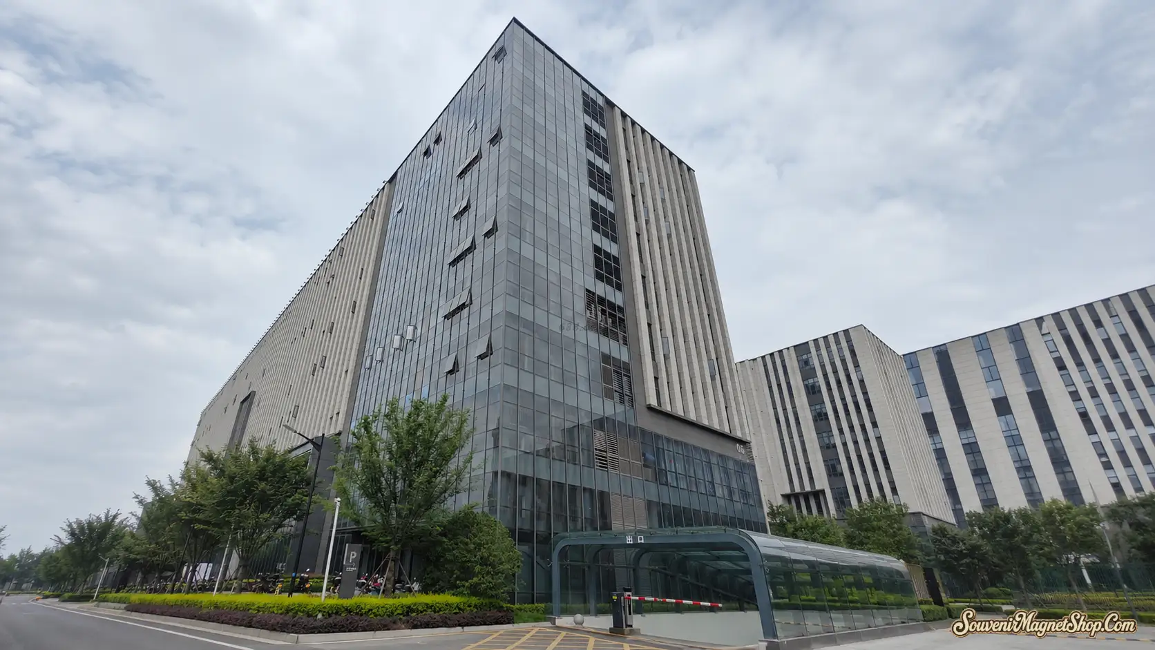 Our modern souvenir magnet factory headquarters in Quanzhou, Fujian — a multi-story production complex covering 3,700 m² of factory floor, design studio, and offices.