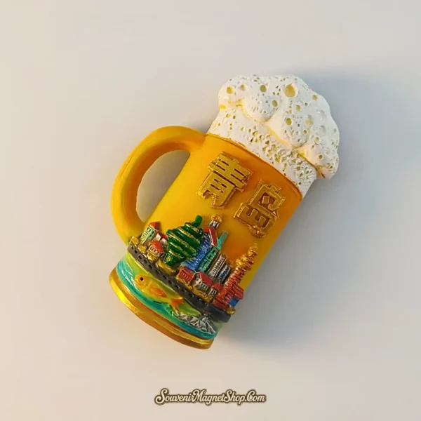 Qingdao Tsingtao souvenir magnet angled view showing tilted beer stein shape, raised Chinese characters and harbor skyline detail