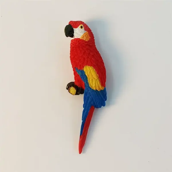 Front view of Dominican Republic scarlet macaw fridge magnet with red yellow and blue feathers
