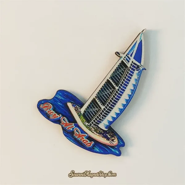 Angled Dubai Burj Al Arab wooden souvenir magnet showing sail-shaped hotel design