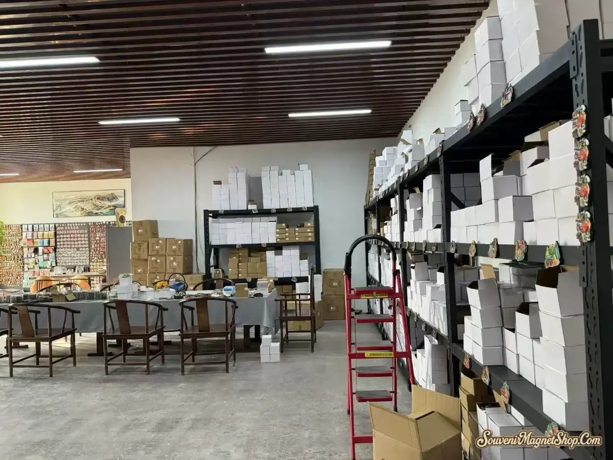 Our factory showroom and packing area in Quanzhou — finished-magnet display, organized inventory racks, and the packing station where every order ships from.