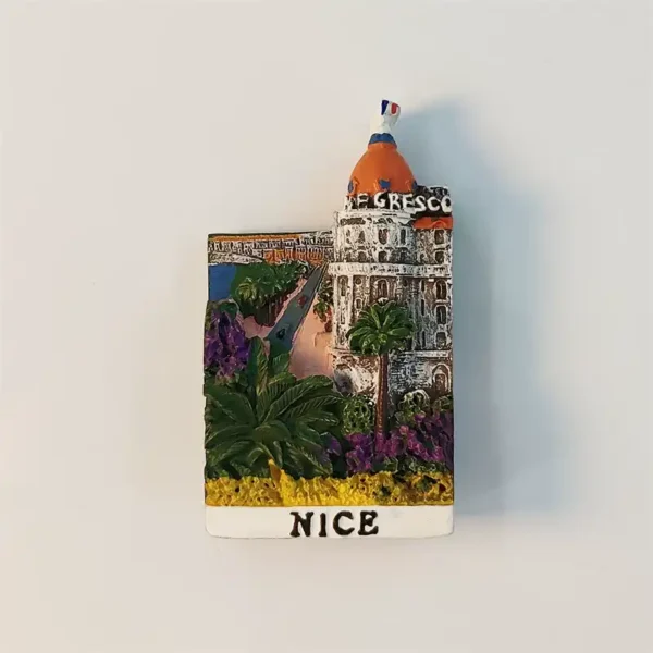 Front view of Nice Hotel Negresco fridge magnet with pink dome, palm trees and NICE lettering