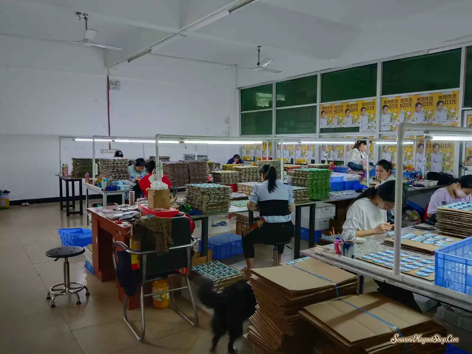 Our hand-finishing workshop in Quanzhou — skilled artisans hand-painting and detailing thousands of souvenir fridge magnets, one batch at a time.