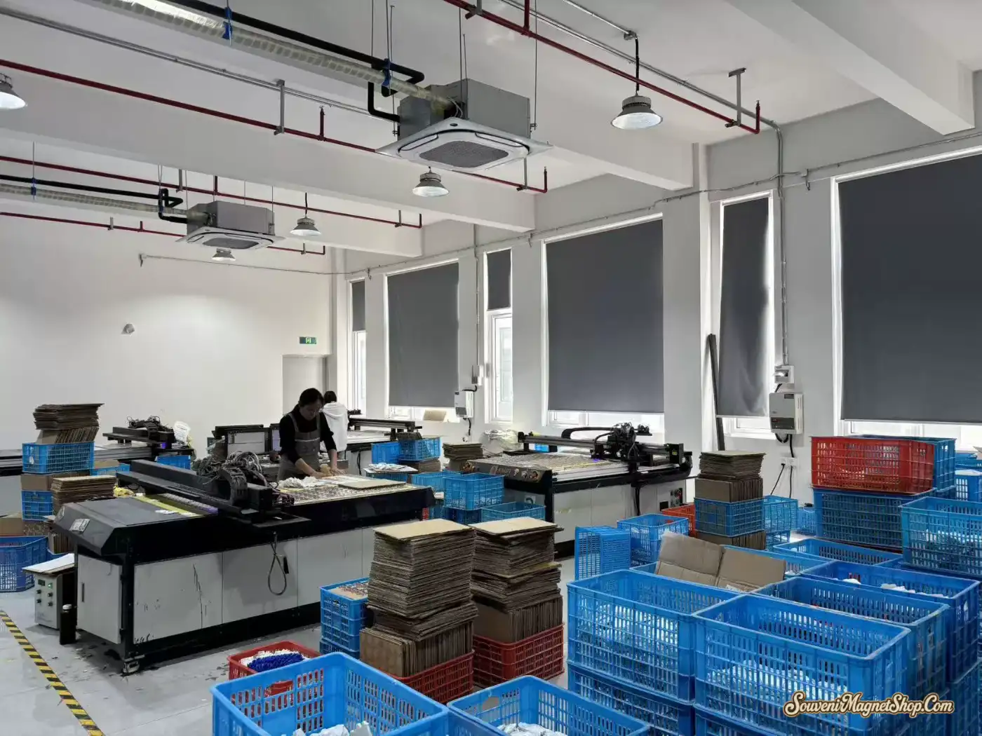 Laser-cutting and die-cutting stations preparing magnet boards and cardboard inserts in our Quanzhou plate-making workshop.