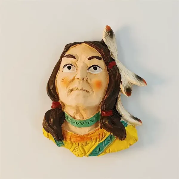 Front view of USA Native American fridge magnet showing 3D bust with braided hair, white feather ornament, green choker and yellow garment