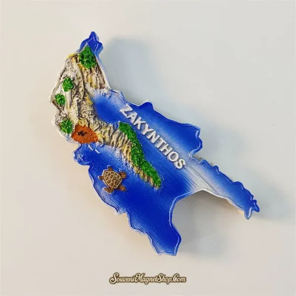 Angle view of Zakynthos souvenir fridge magnet showing 3D west coast cliffs and deep blue Ionian sea detail
