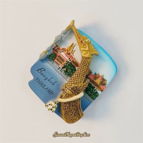 Bangkok souvenir magnet showing 3D hand-painted golden royal barge and Thai temple skyline at an angle